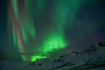 Northern lights above mountains